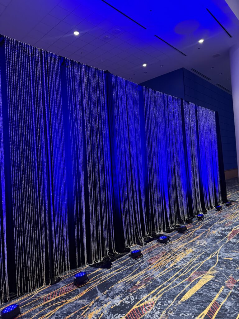 Drape with Crystal Curtains and Blue Uplights
